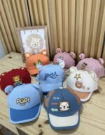 MEDIA DOCENA GORRA BEBÉ UNISEX - Imagen 2